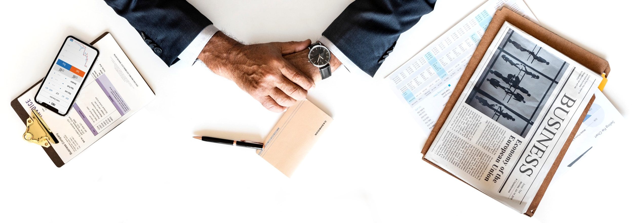 Top view of a businessman and various office items